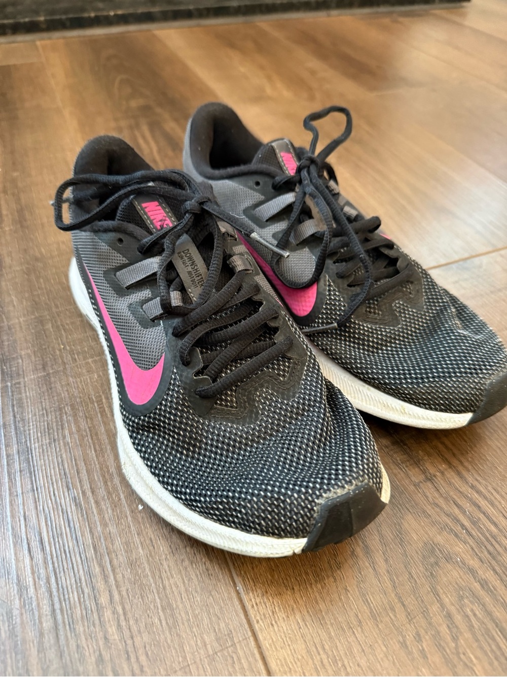 Nike Women's Black Running Sneakers with Pink Swoosh